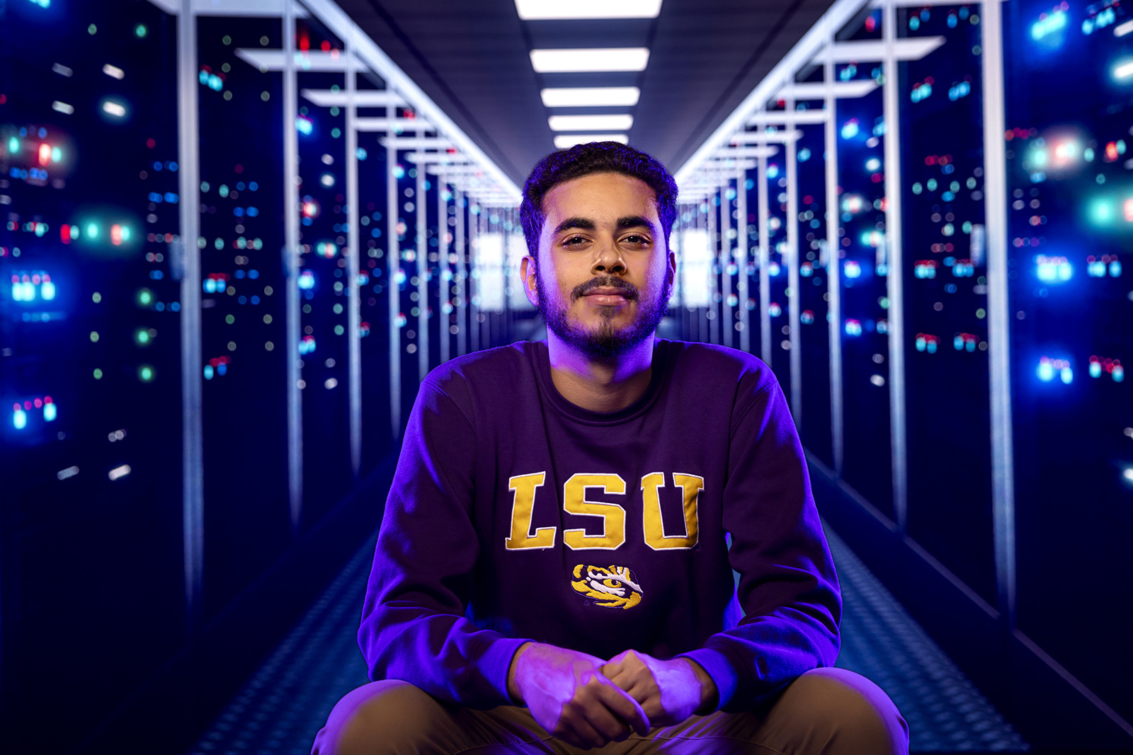 Ali Habib portrait with computer panel backdrop