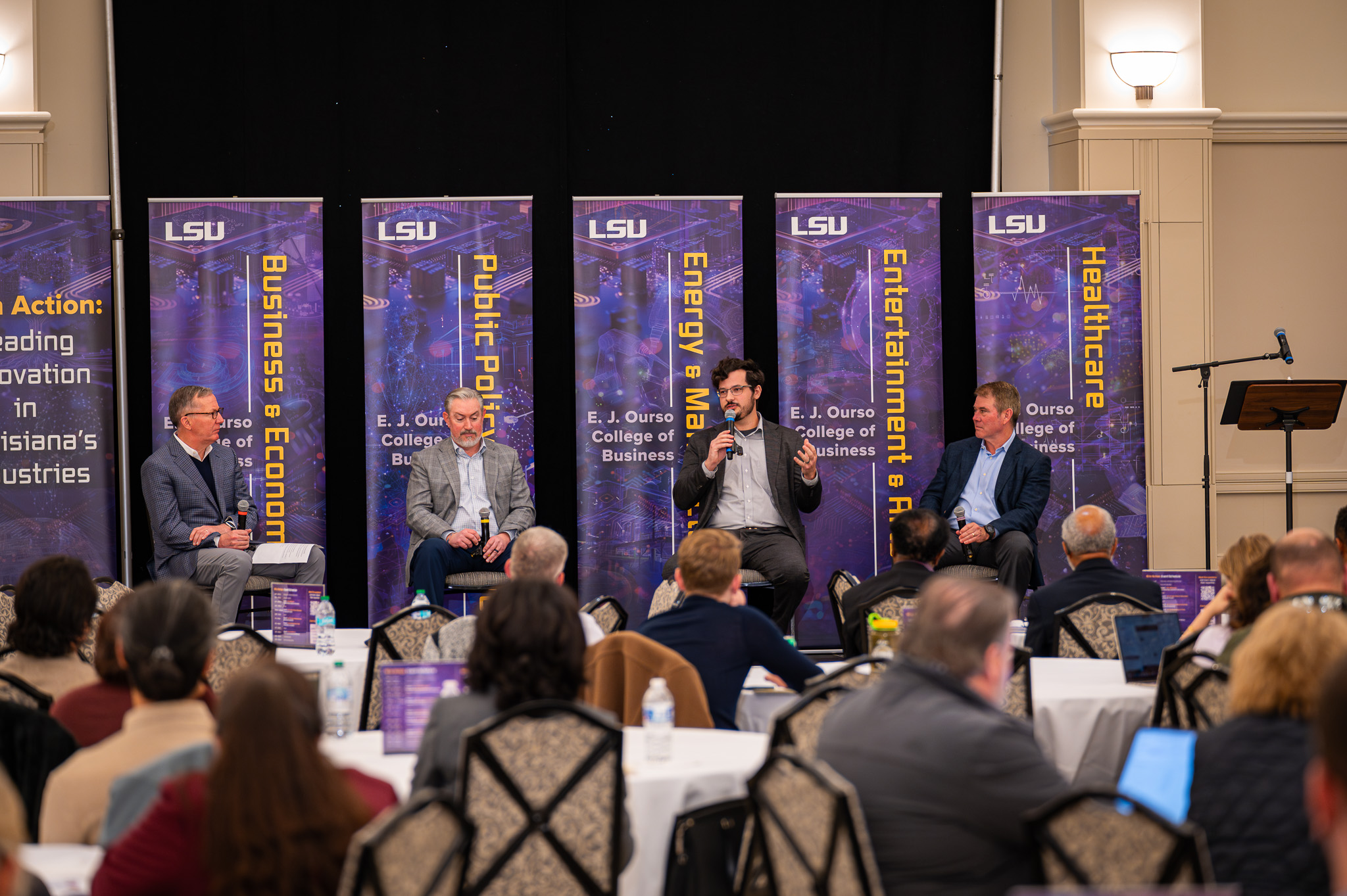 Members of the AI in Energy and Manufacturing panel hold a discussion at the AI in Action Symposium on February 21, 2025.