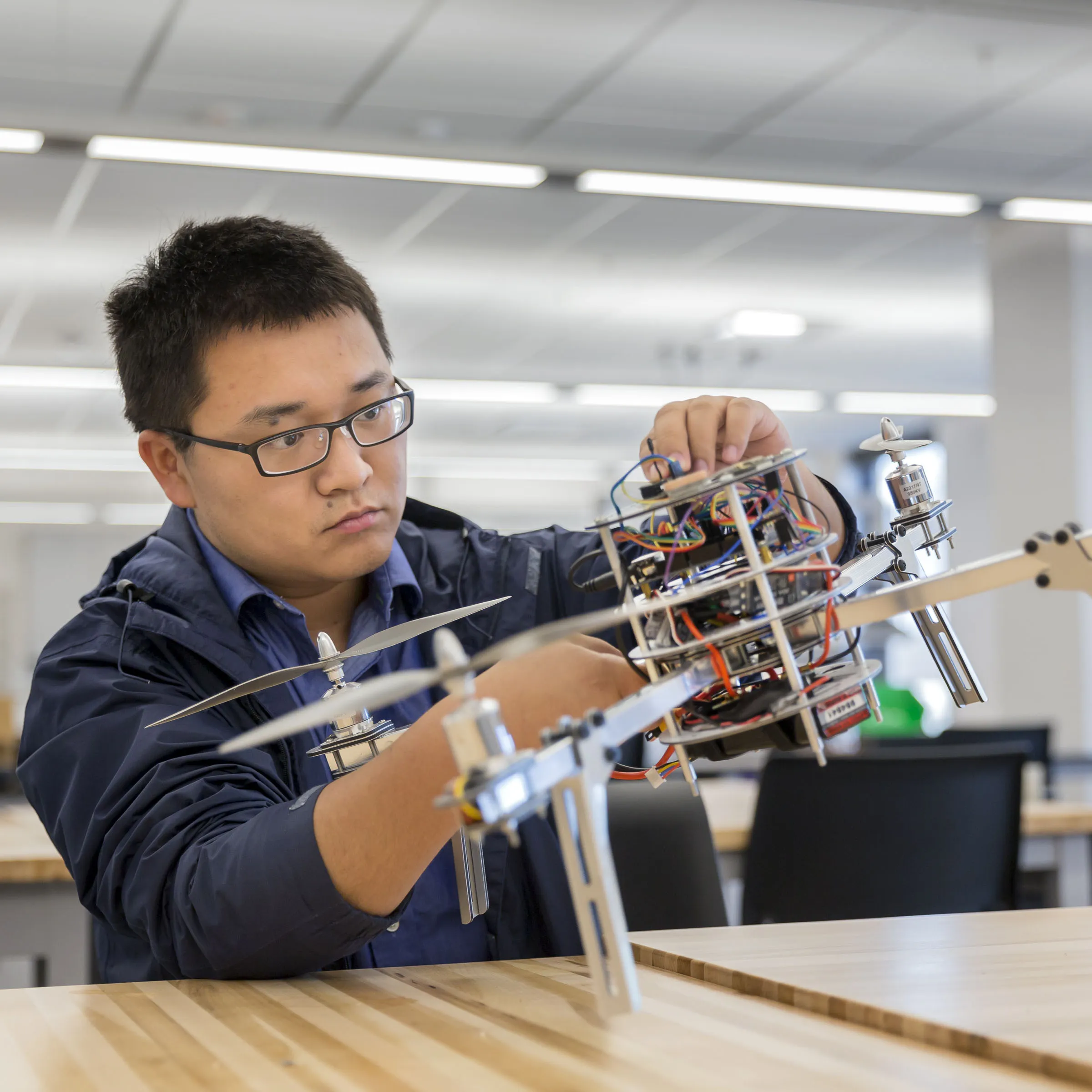 Student working on a flying drone