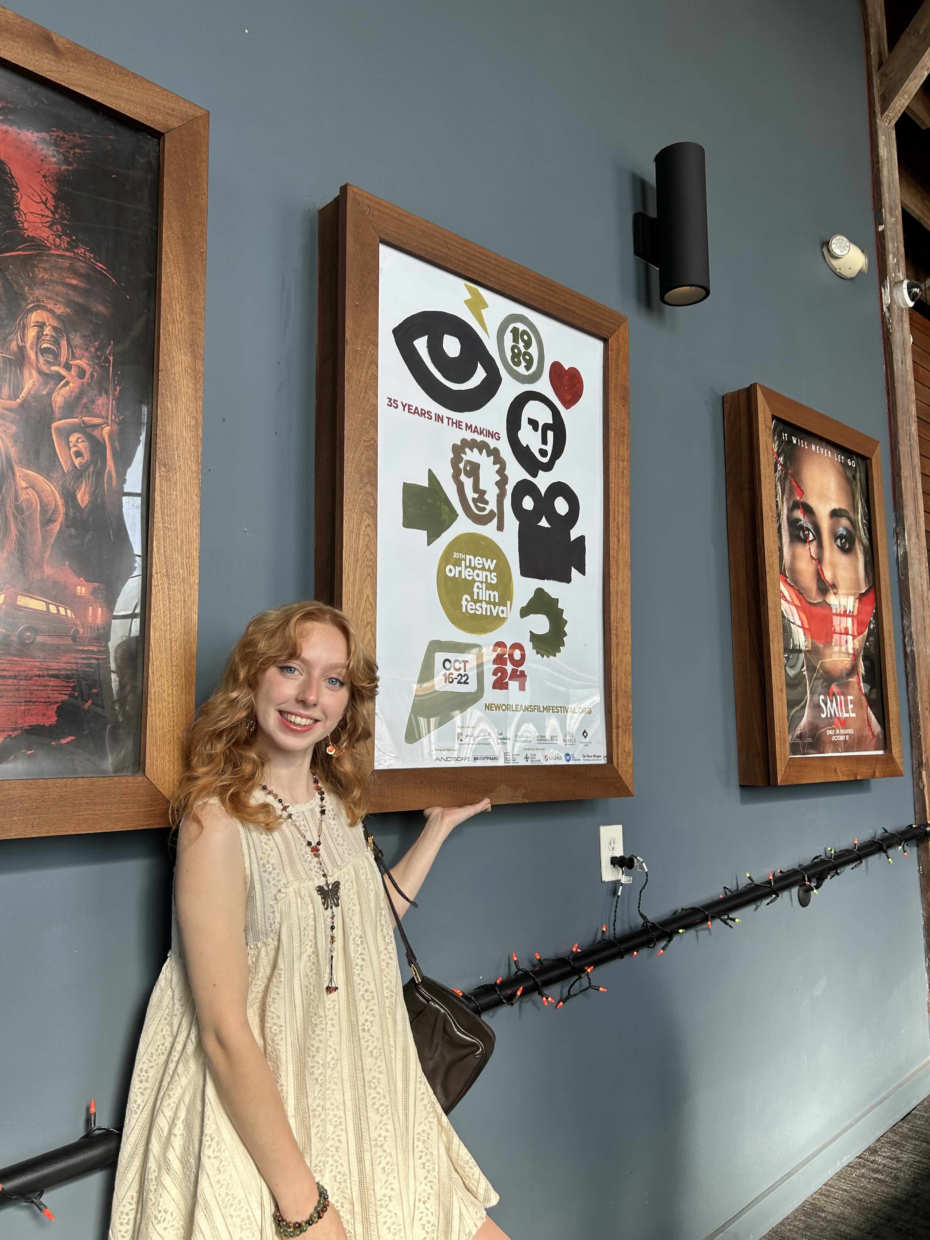 Millie Rigdon posing with Festival Poster