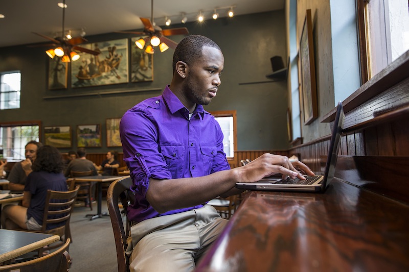 photo: student working on laptop