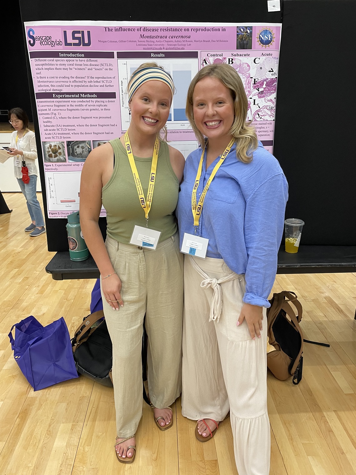 Two students presenting a research poster