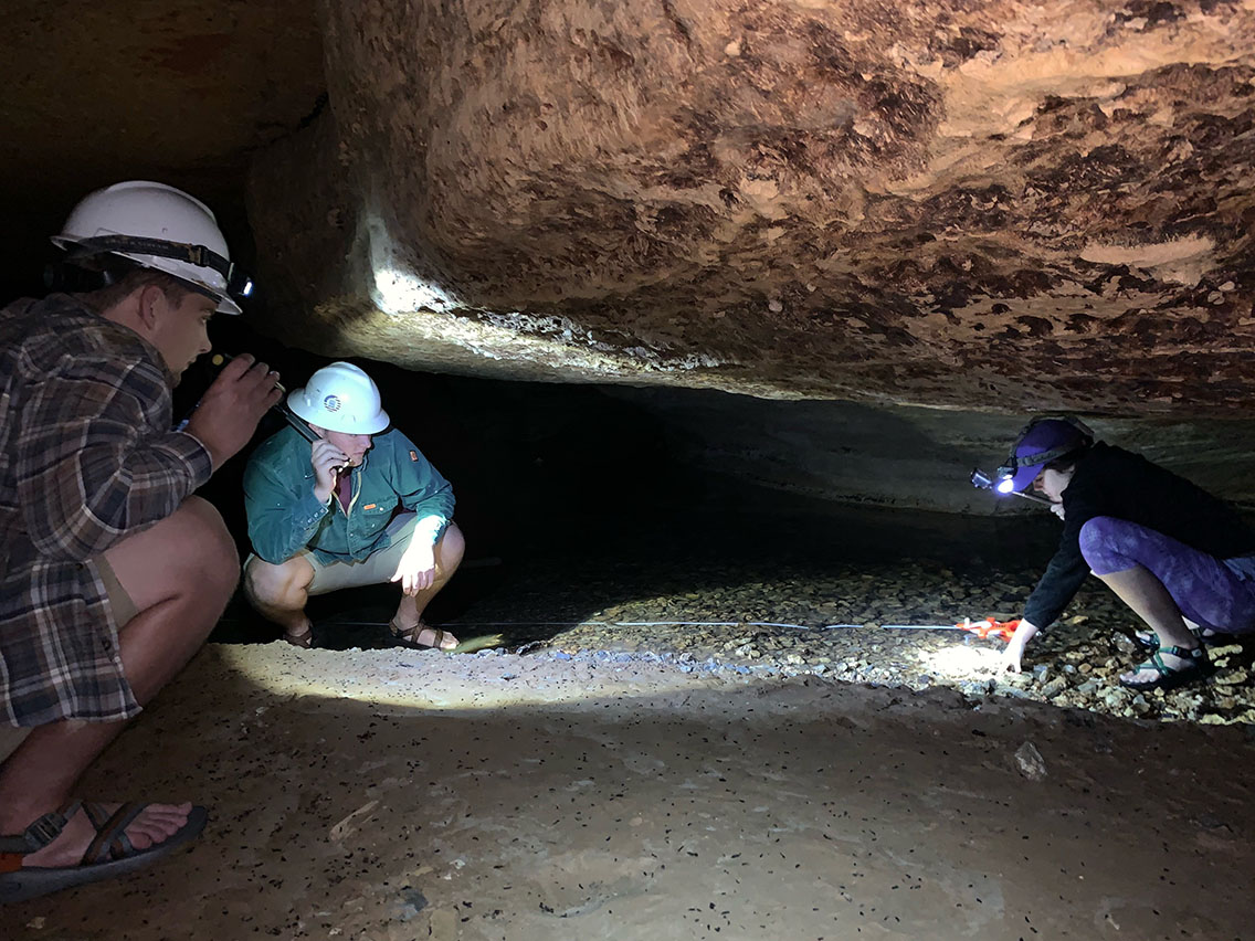 student in cave