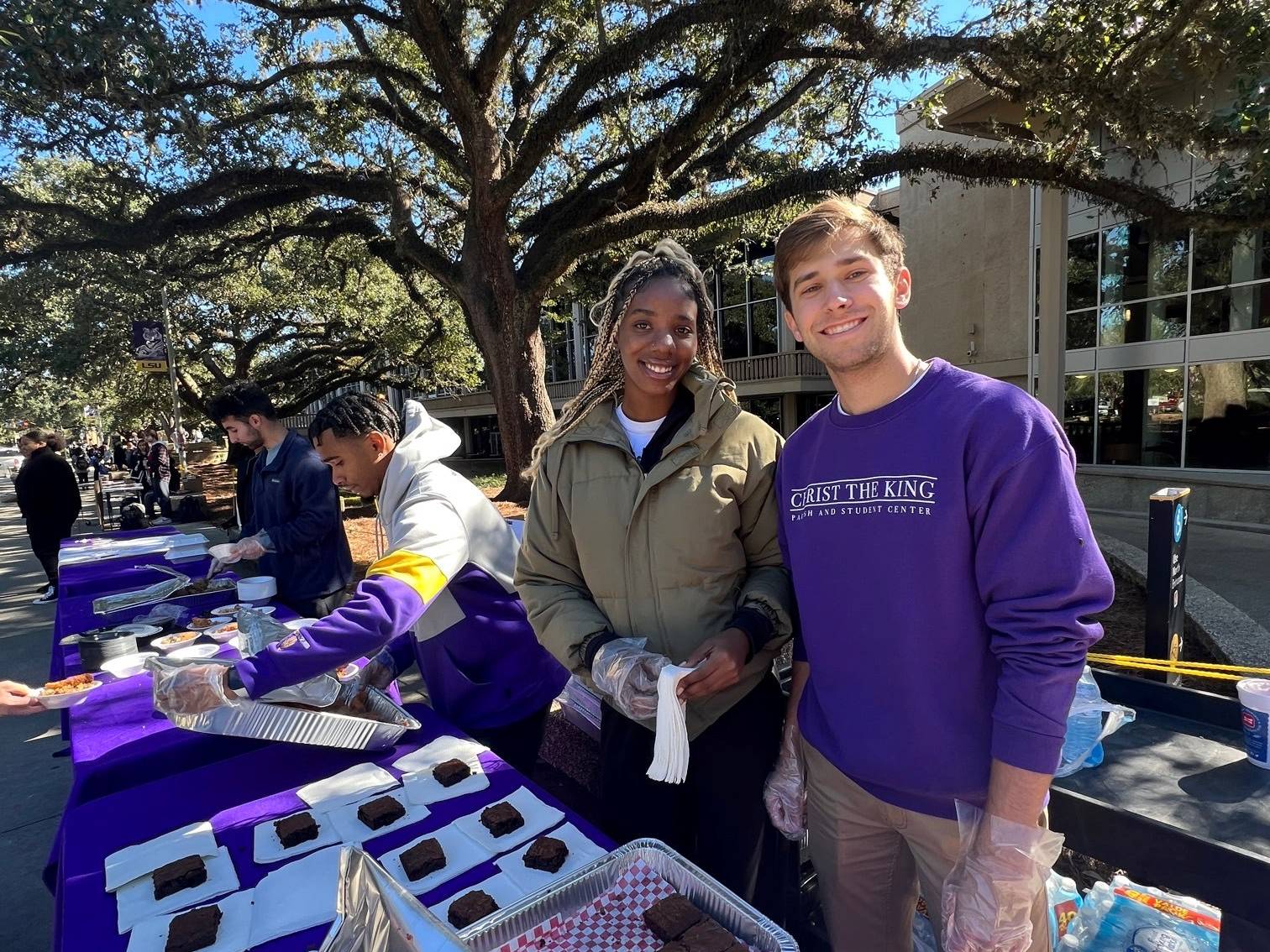 students at table sit in free speech plaza