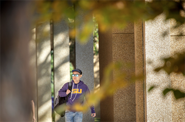 student walking in autumn