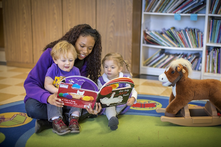 student reading with children