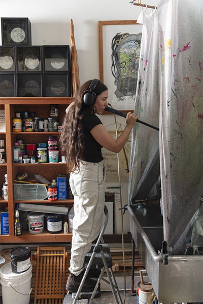 Frisbie-Calder working in studio